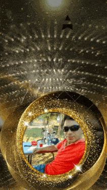 a man in a red shirt is sitting in a gold frame