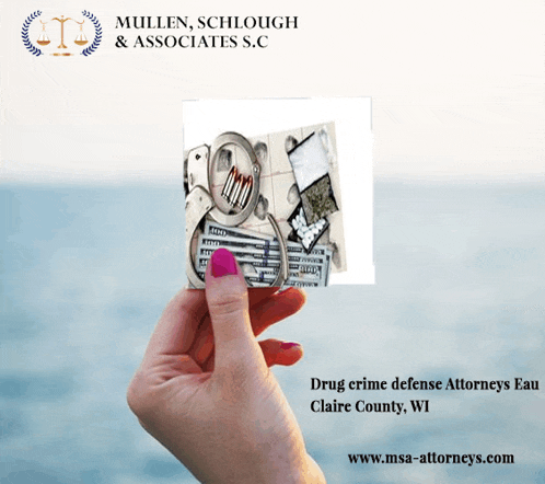 a hand holding a card that says mullen schlough & associates s.c