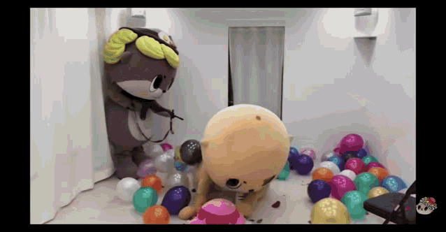 a stuffed animal is standing in a room filled with balloons .