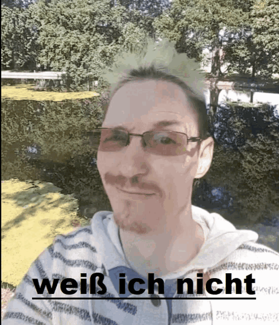 a man wearing glasses and a striped shirt has the words weiß ich nicht written below him