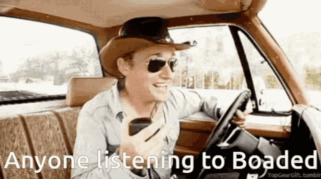 a man wearing a cowboy hat and sunglasses is sitting in a car with the words " anyone listening to boated "