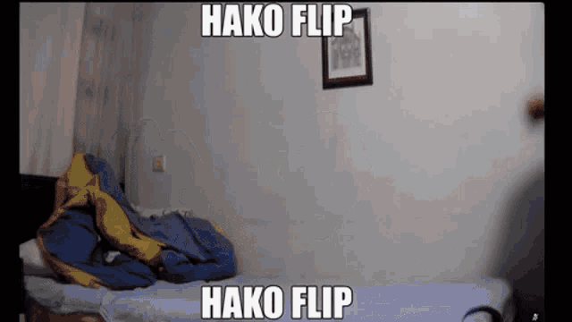 a video of a person laying on a bed with the words " hako flip " on the bottom