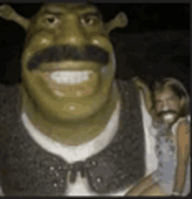 shrek is holding a little girl in his arms while shrek is smiling .