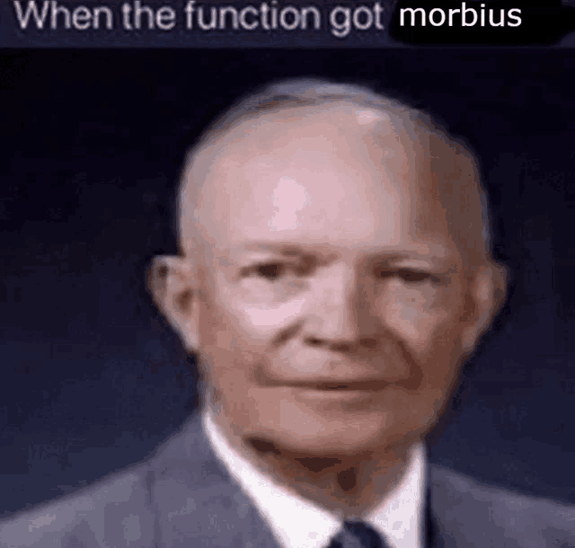 a bald man in a suit and tie is looking at the camera with the caption `` when the function got morbidus '' .