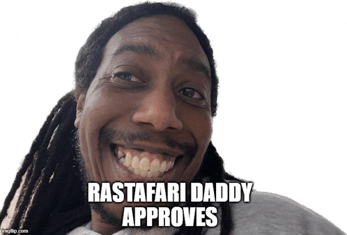 a man with dreadlocks is smiling with the words rastafari daddy approves below him