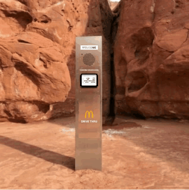 a mcdonald 's drive thru is in the middle of a desert