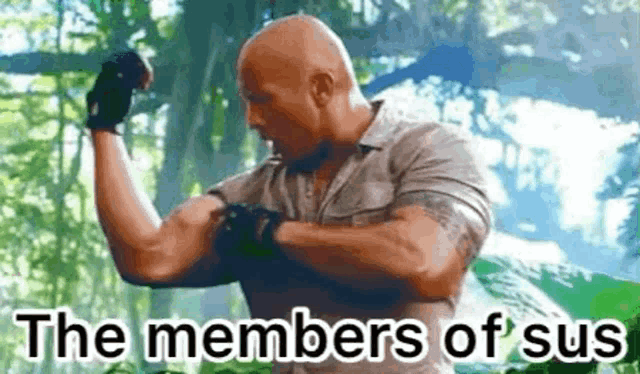 a man is flexing his muscles in the woods with the words `` the members of sus '' .
