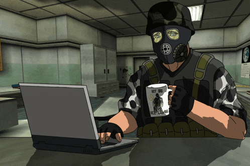 a man wearing a gas mask is sitting at a desk with a laptop and a mug that says hey bro