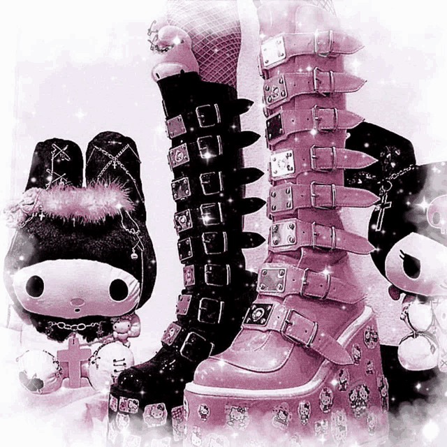 a pair of black and pink boots sitting next to a hello kitty