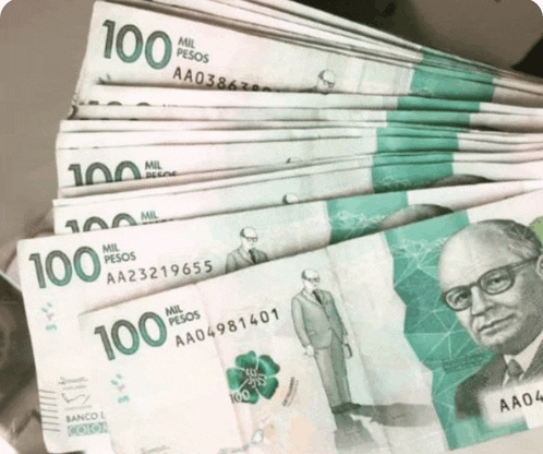 a stack of 100 pesos bills with a man on them