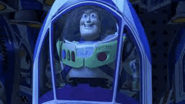 buzz lightyear from toy story is sitting in a spaceship in a dark room .