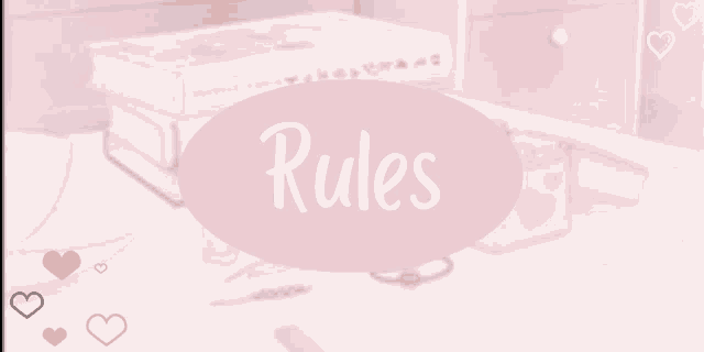 a pink sign with the word rules written on it