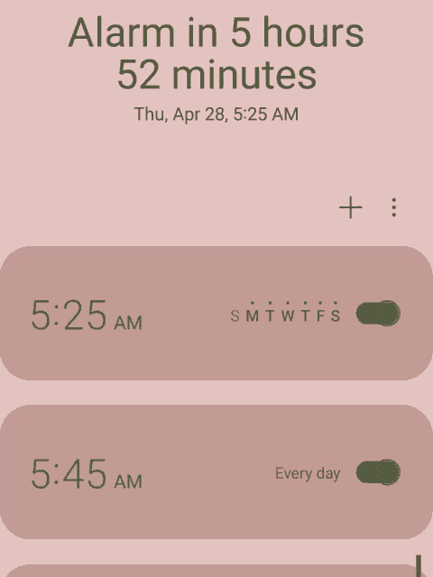 a phone screen shows that the alarm is in 5 hours and 52 minutes