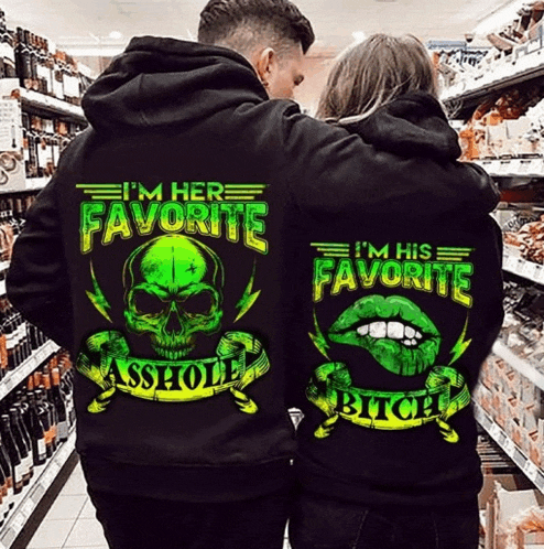 a man and woman wearing black hoodies that say i 'm her favorite and i 'm his favorite asshole bitch