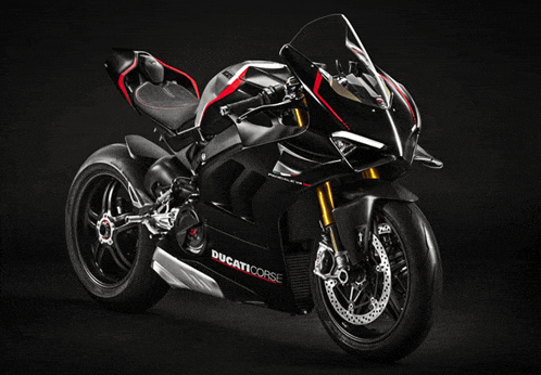 a black ducati corse motorcycle is sitting on a black surface