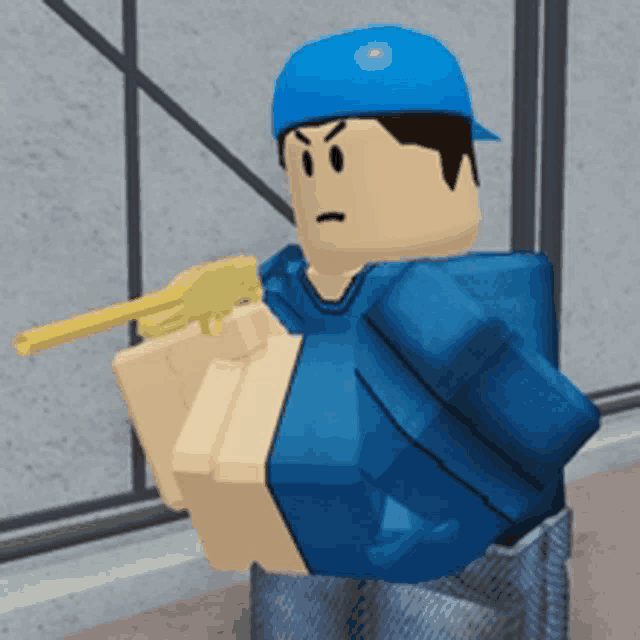 a man in a blue hat is holding a gun in his hand