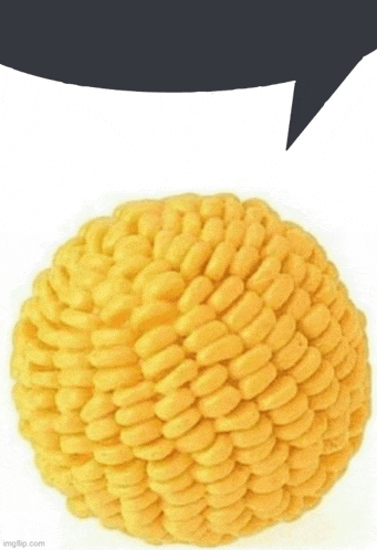 a close up of a corn on the cob with a speech bubble .