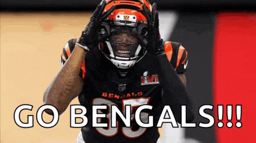 a bengals football player celebrates with the words go bengals