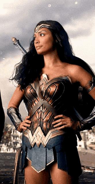 a woman in a wonder woman costume with a sword