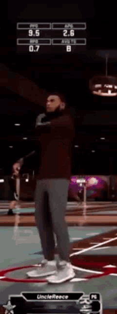 a man is standing on a basketball court with a scoreboard behind him that says unclerence