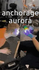 a person is sitting in a chair with a balloon in their hand and the words anchorage aurora on the bottom