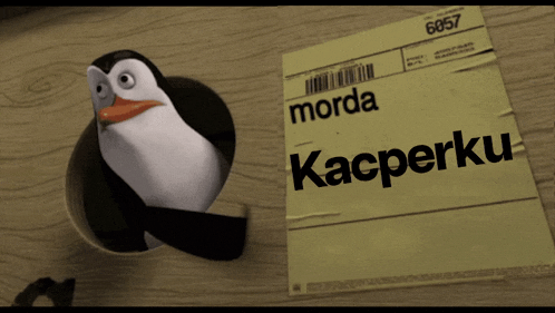 a penguin is sticking its head out of a hole next to a piece of paper which says morda kacperku