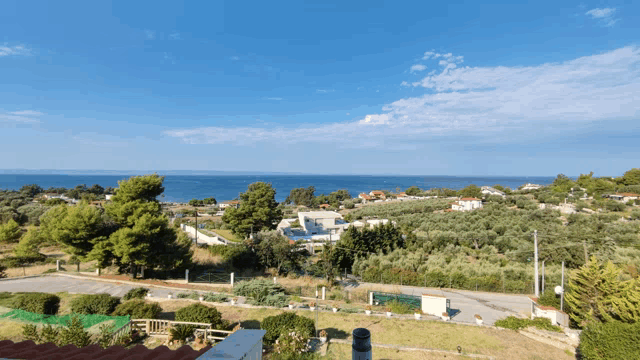 a view of the ocean from a rooftop with a chimney