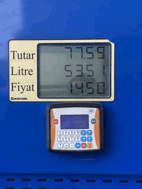 a digital display shows the price of a litre of gas