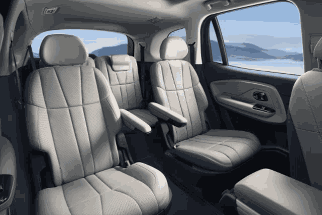 the back seat of a car with a view of the mountains