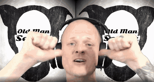 a bald man wearing headphones with the words old man sc on the bottom