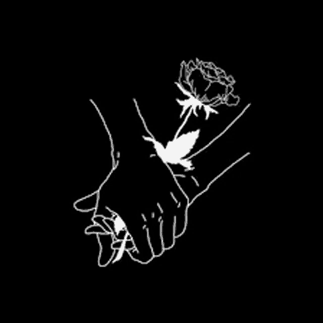 a couple of hands holding a rose in their hands on a black background .