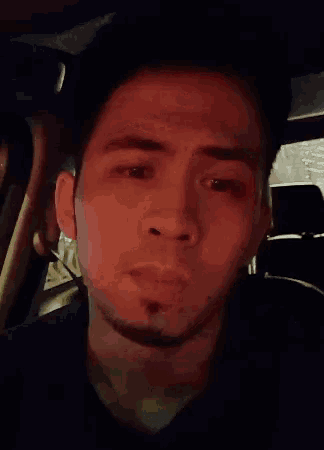 a close up of a man 's face with the word okayyy written below it