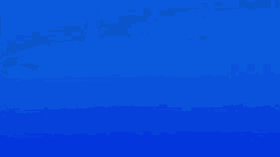 a boat is floating in the middle of a deep blue ocean