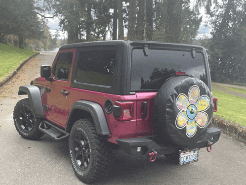 a pink jeep with a license plate that says california