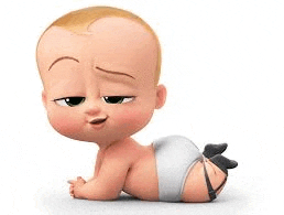 a baby from the boss baby is laying on his stomach on the floor .