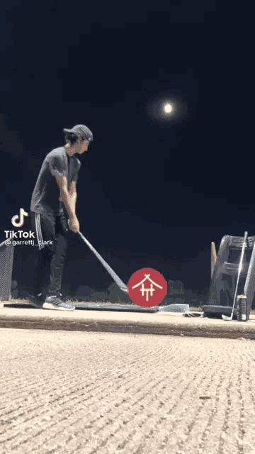 a tik tok video of a man swinging a golf club at a ball