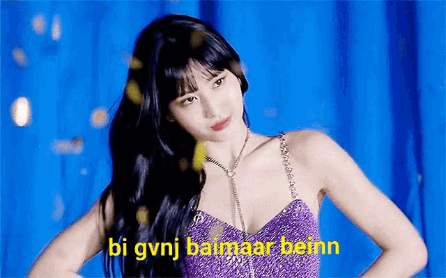 a woman in a purple dress with the words bi gvnj baimaar beinn on the bottom .