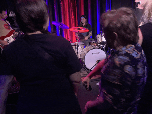 a ludwig drum is being played in a dark room