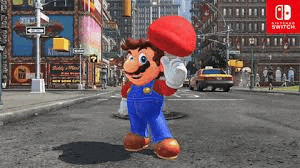 mario is walking down a city street in a video game for the nintendo switch .