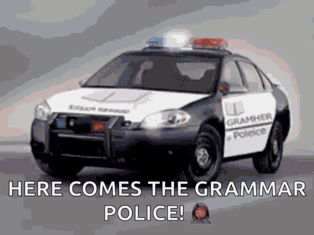 a police car with the words here comes the grammar police written on it
