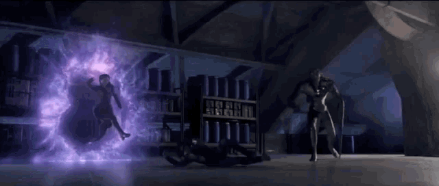 two people are fighting in a room with purple lights .