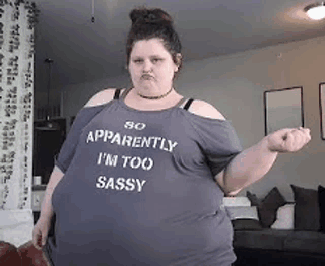 a woman wearing a t-shirt that says `` apparently i 'm too sassy ''