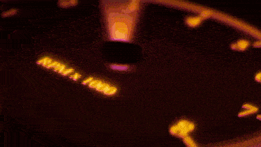 a car that looks like it is on fire is driving down a road