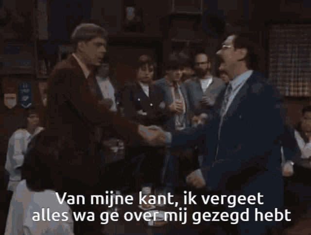 a man with glasses and a mustache says van mijne kant