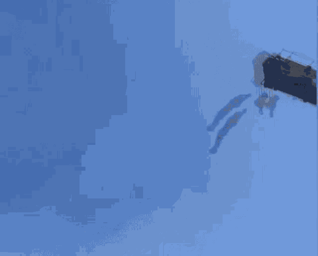 a person is jumping off the roof of a building .