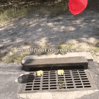 a red balloon is floating over a manhole cover with the words " we all float down here " below it