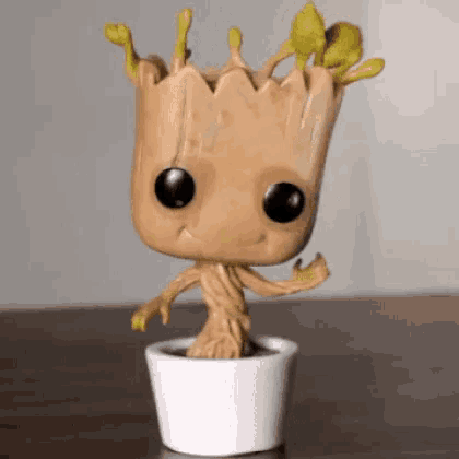 a funko pop of groot from guardians of the galaxy is sitting on a table