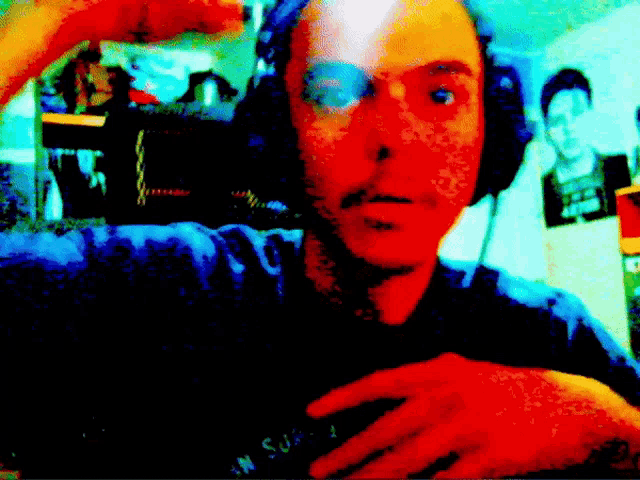 a man wearing headphones and a t-shirt that says ' n.s.w. ' on it