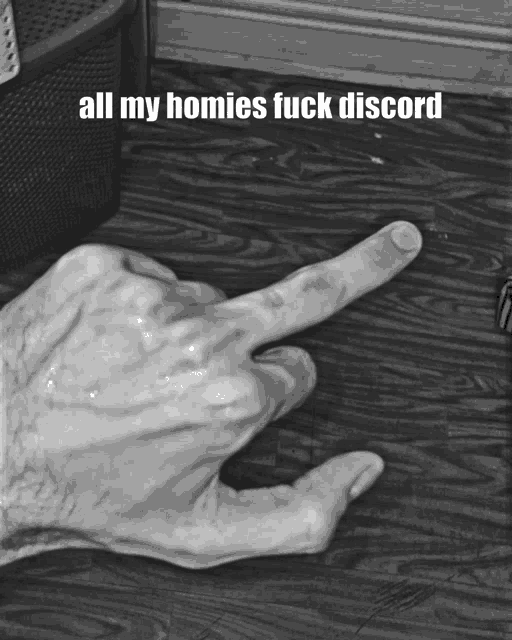 a black and white photo of a person 's hand pointing at something with the caption all my homies fuck discord