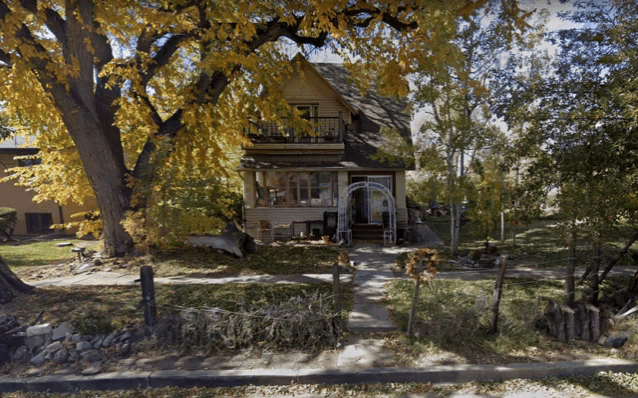 a house with a tree in front of it